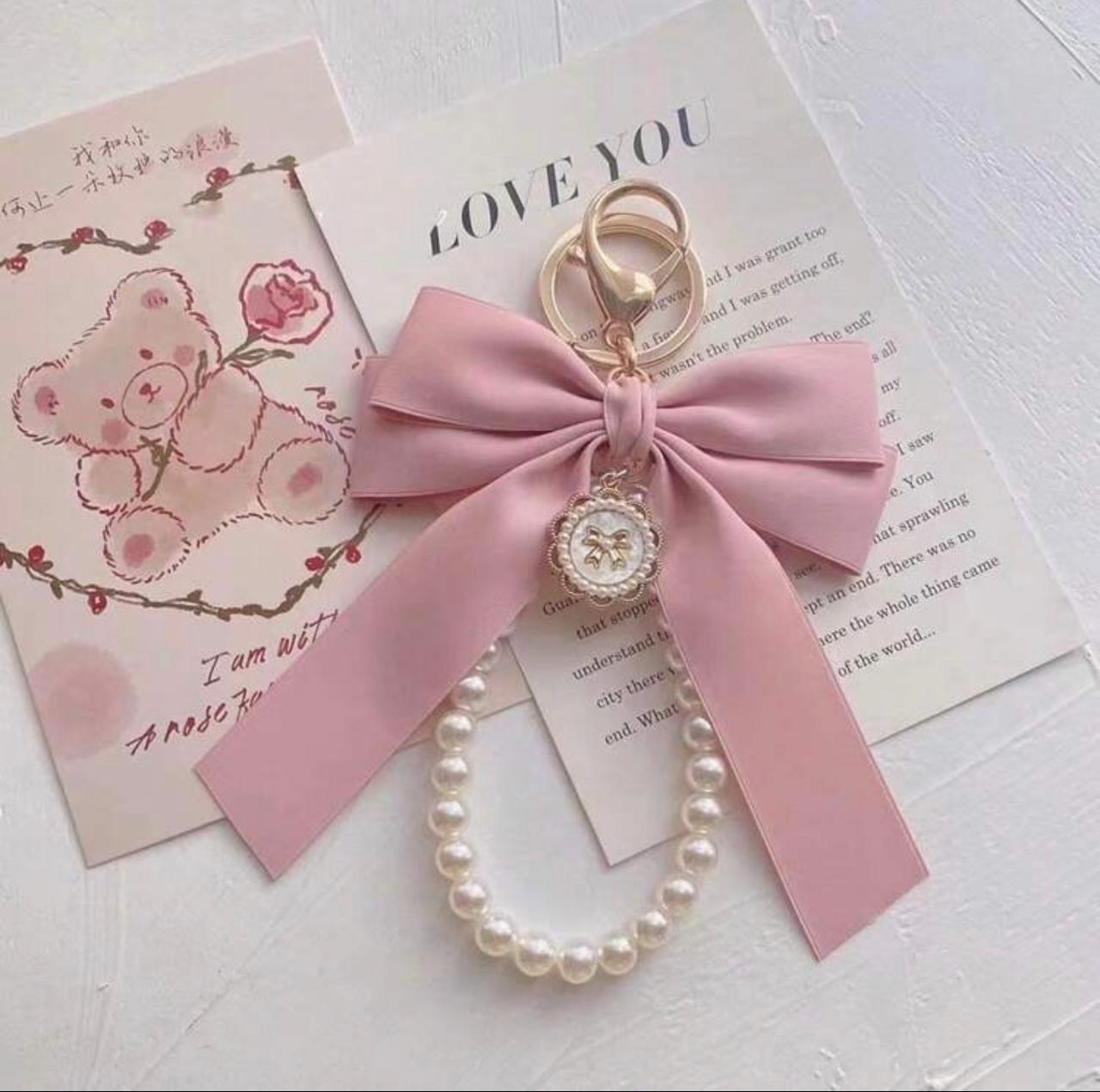 LLAVERO CHARMS DE MOÑO ROSA
