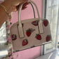 BOLSO COACH DE FRESAS DUPE