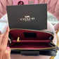 BILLETERA COACH NEGRA CON RELIEVE
