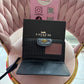 BILLETERA COACH NEGRA LISO