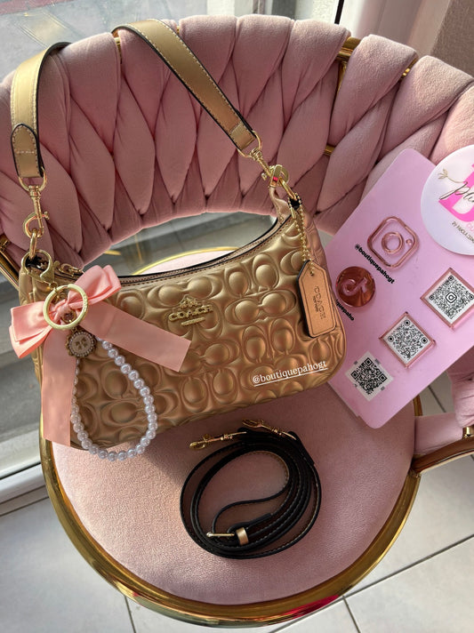 BOLSO COACH DORADO DUPE